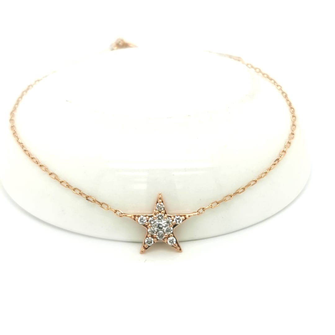 Diamond star chain bracelet in 18k rose gold.