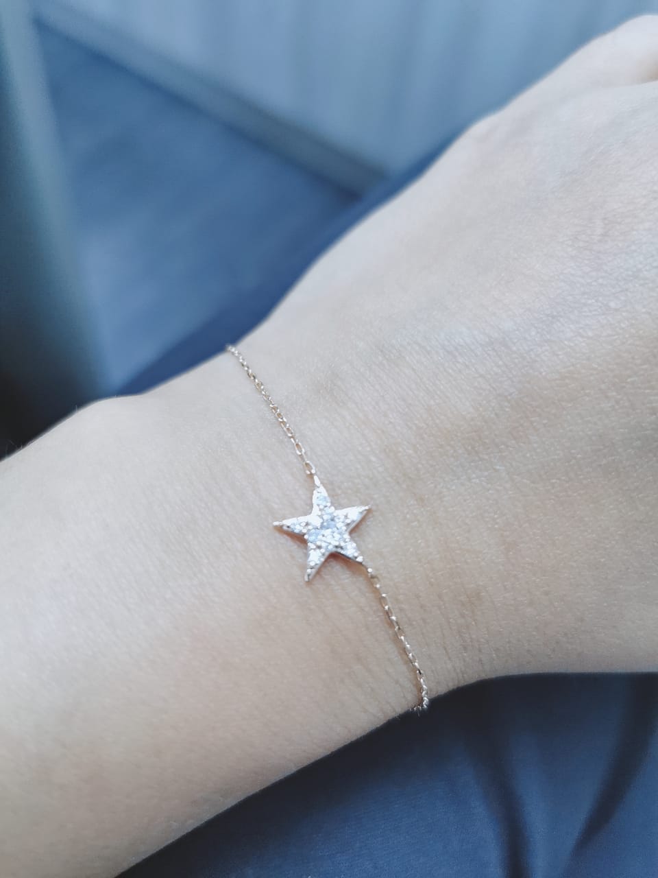Presenting a captivating diamond star attached to a delicate chain bracelet, this piece effortlessly combines celestial beauty with elegant simplicity. The bracelet features a stunning diamond-encrusted star charm suspended from a dainty chain, creating a celestial-inspired accessory that shines with celestial brilliance.