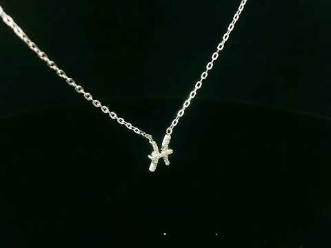 Pisces zodiac necklace in 18K gold with 0.06 carat diamond accents on fine chain