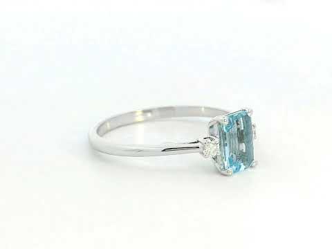 18K white gold aquamarine and diamond ring featuring a 0.65-carat emerald-cut aquamarine with 0.07-carat round diamonds in a minimalist fine jewelry design – perfect for engagements, gifts, and March birthstone jewelry.