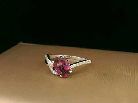 18K white gold Rhodolite garnet and diamond crossover ring with oval-cut center stone
