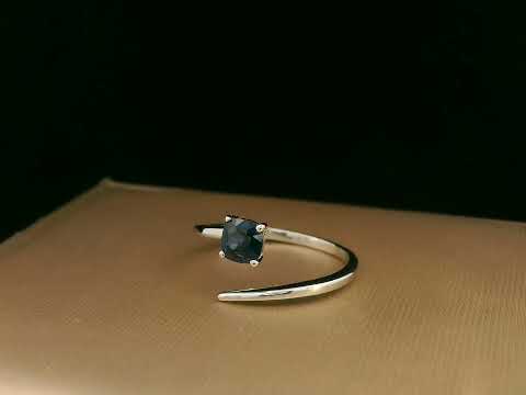 18K gold bypass ring with 0.49 carat cushion-cut blue sapphire, sleek modern design