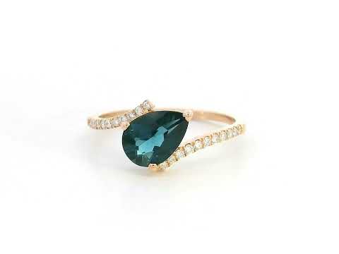 18K rose gold ring with pear-shaped London Blue Topaz and pavé diamond band