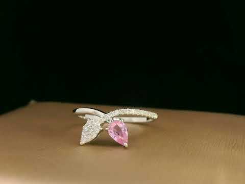 18K white gold bypass ring featuring 0.37ct pear pink sapphire and 0.15ct diamonds in a modern pear motif design.