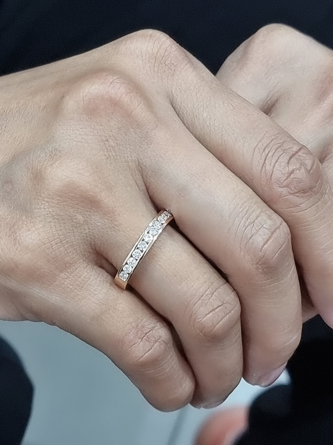 Elegant 18K yellow gold eternity band featuring 0.63ct channel-set round diamonds, perfect as a wedding, stacking, or anniversary ring.