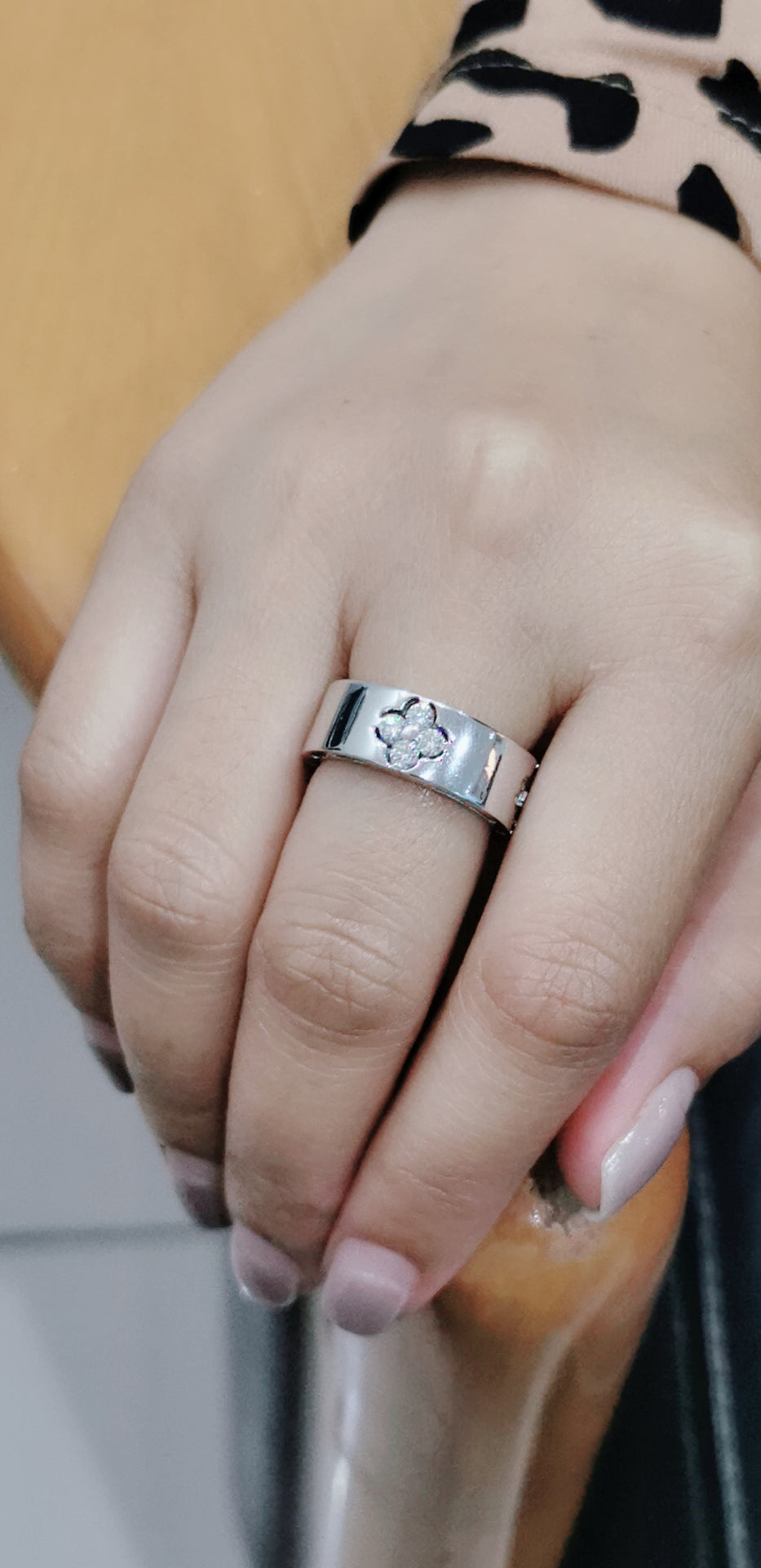 Flat, Pipe Cut Band Diamond Ring With A Floral Cluster In 18k White Gold.