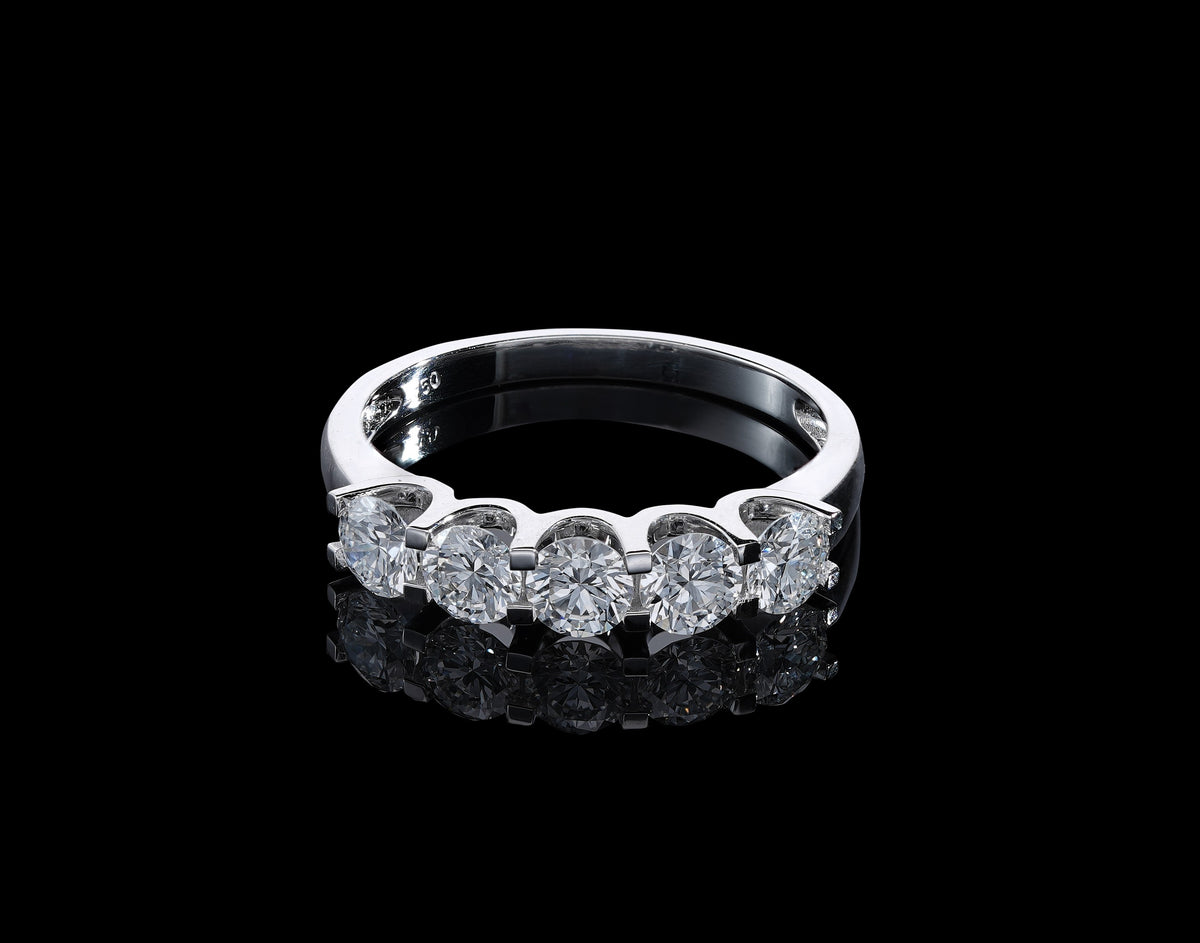 Five stone diamond band ring in 18K white gold with round brilliant diamonds set across the front