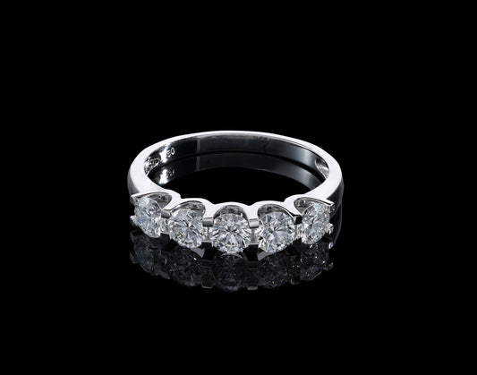 Five stone diamond band ring in 18K white gold with round brilliant diamonds set across the front