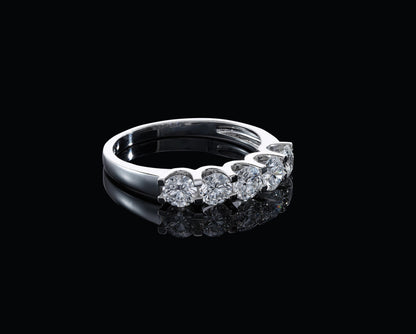 Five stone diamond band ring in 18K white gold with round brilliant diamonds set across the front