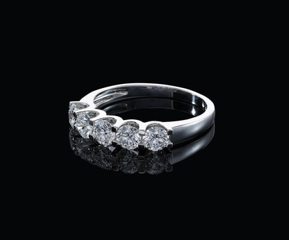 Five stone diamond band ring in 18K white gold with round brilliant diamonds set across the front