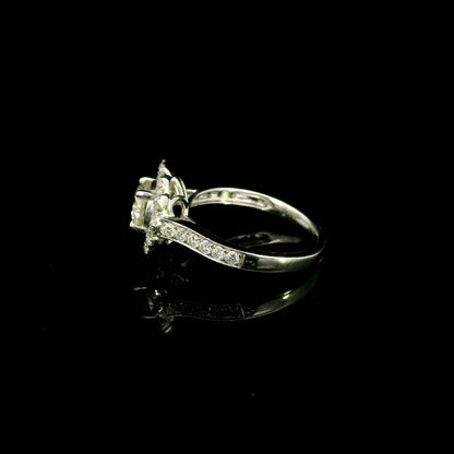 18K white gold diamond halo engagement ring featuring a 1 Carat round brilliant centre diamond with 0.79 Carat natural diamond halo and shoulders.