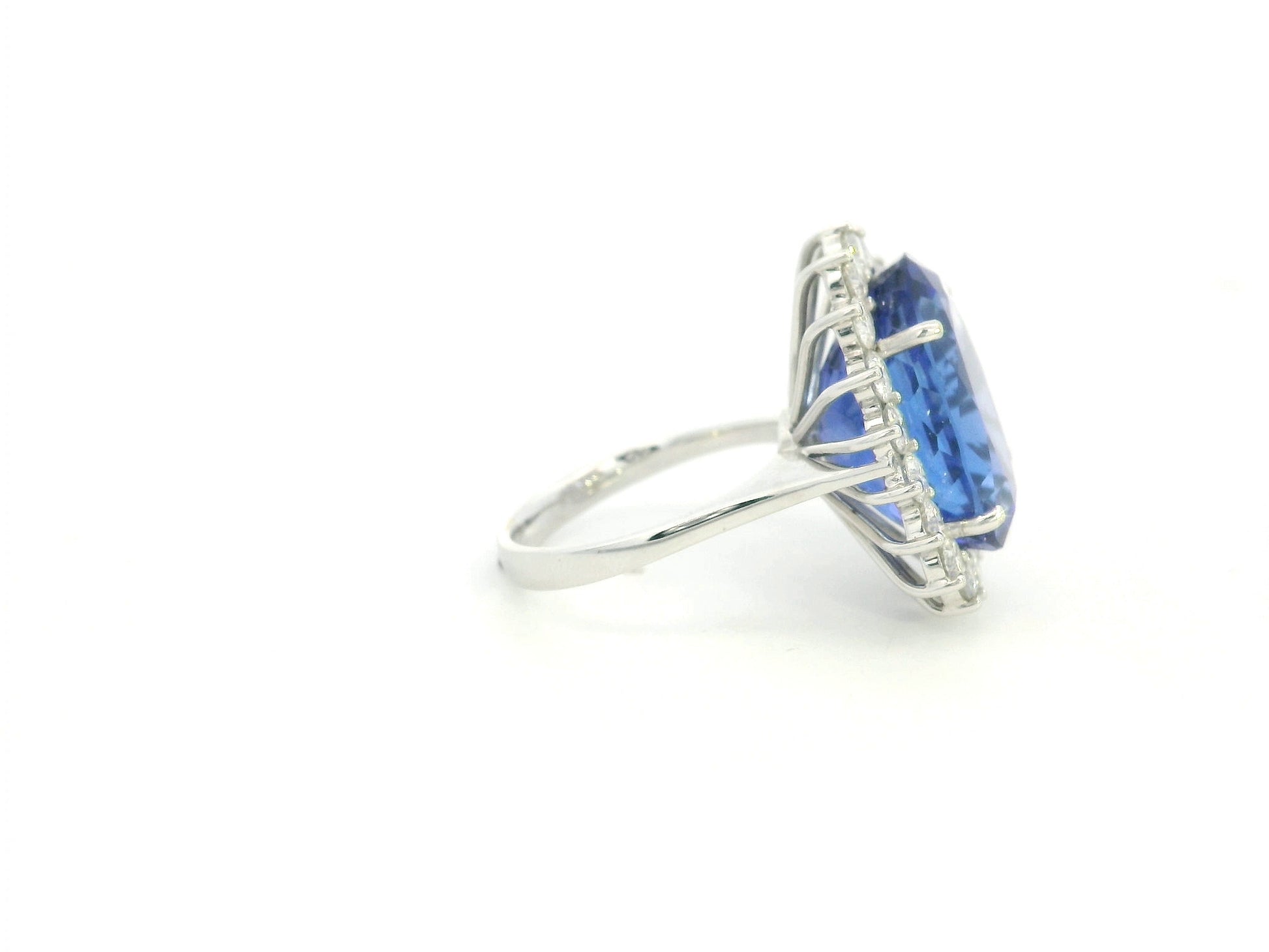 18K white gold oval tanzanite statement ring with diamond halo and 16.11 carat tanzanite by Emirates Diamonds