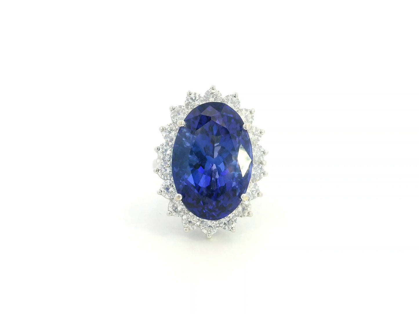 18K white gold oval tanzanite statement ring with diamond halo and 16.11 carat tanzanite by Emirates Diamonds