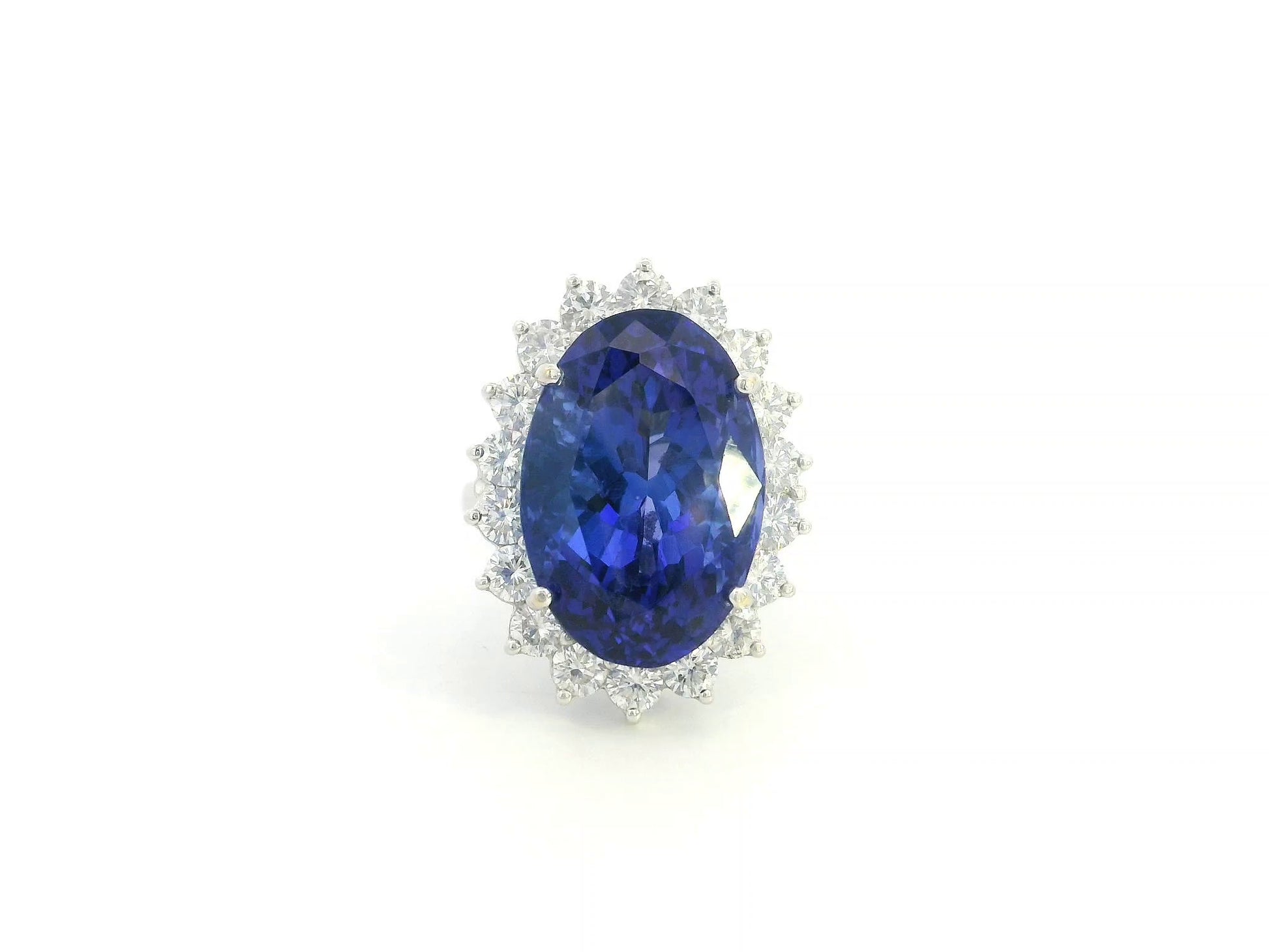 18K white gold oval tanzanite statement ring with diamond halo and 16.11 carat tanzanite by Emirates Diamonds
