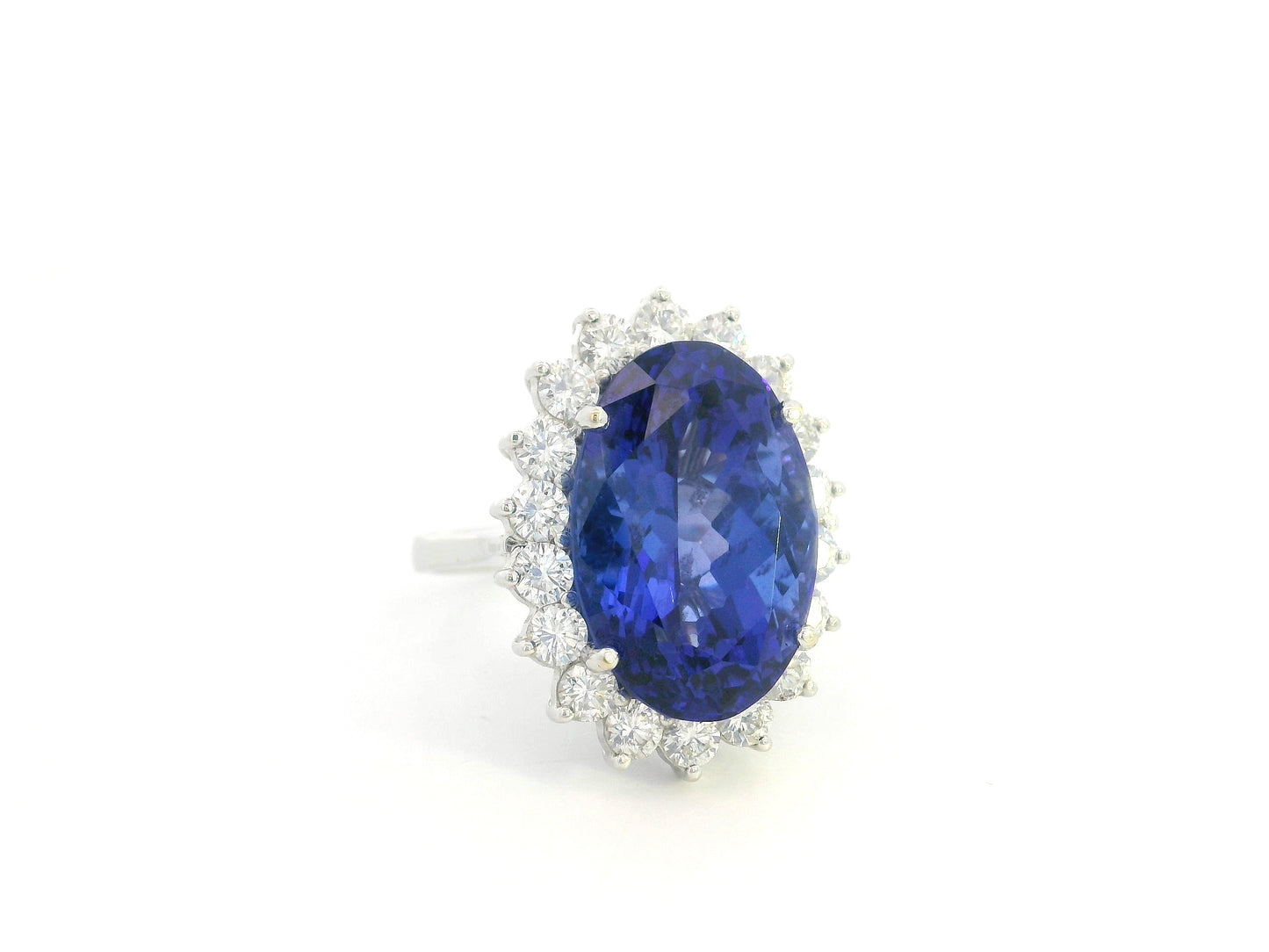 18K white gold oval tanzanite statement ring with diamond halo and 16.11 carat tanzanite by Emirates Diamonds