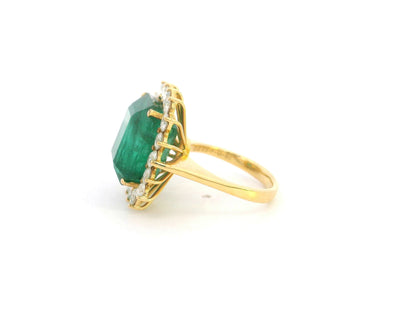 14.87 carat emerald and diamond halo statement ring in 18K yellow gold by Emirates Diamonds