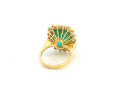 14.87 carat emerald and diamond halo statement ring in 18K yellow gold by Emirates Diamonds