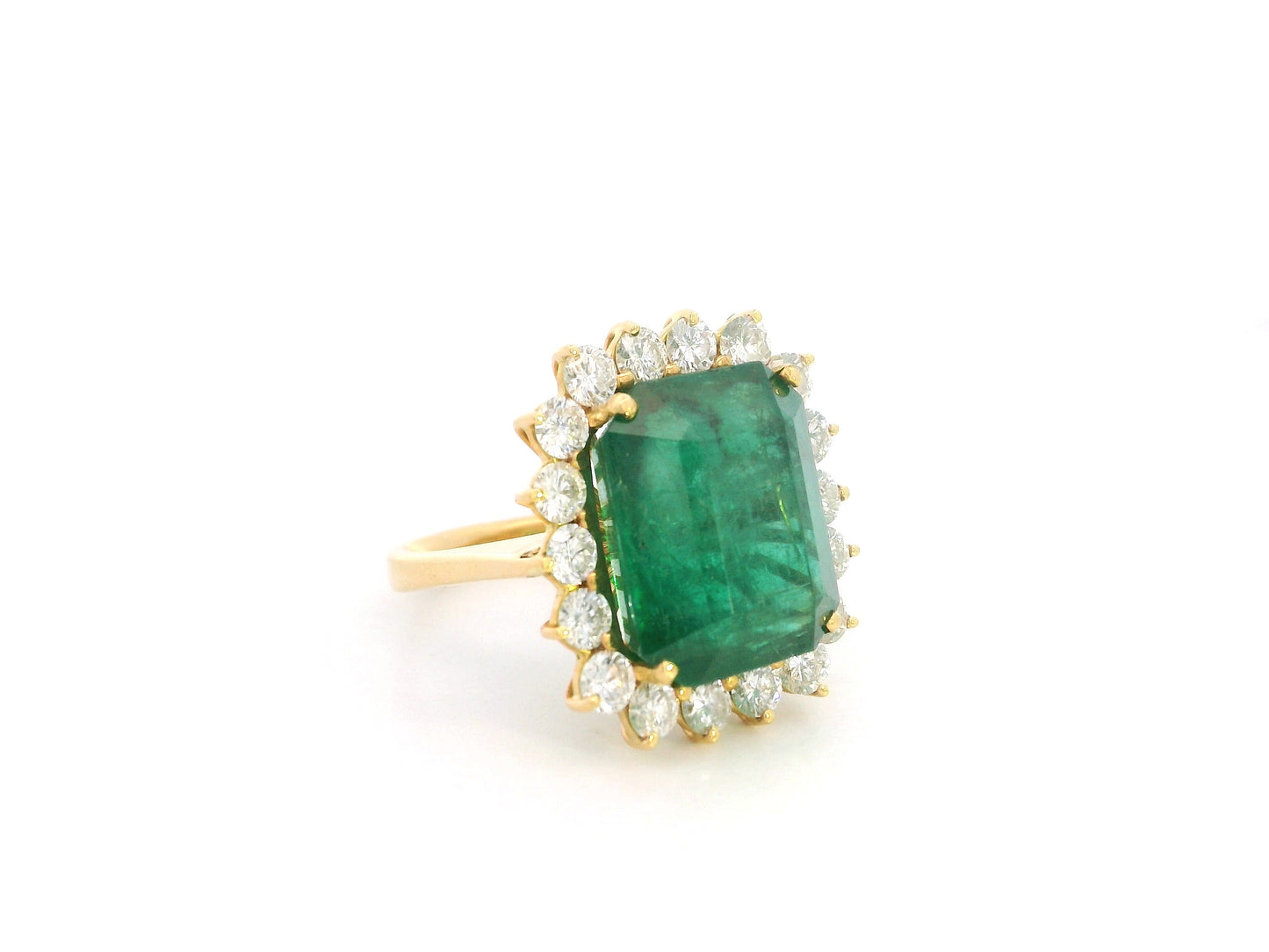 14.87 carat emerald and diamond halo statement ring in 18K yellow gold by Emirates Diamonds