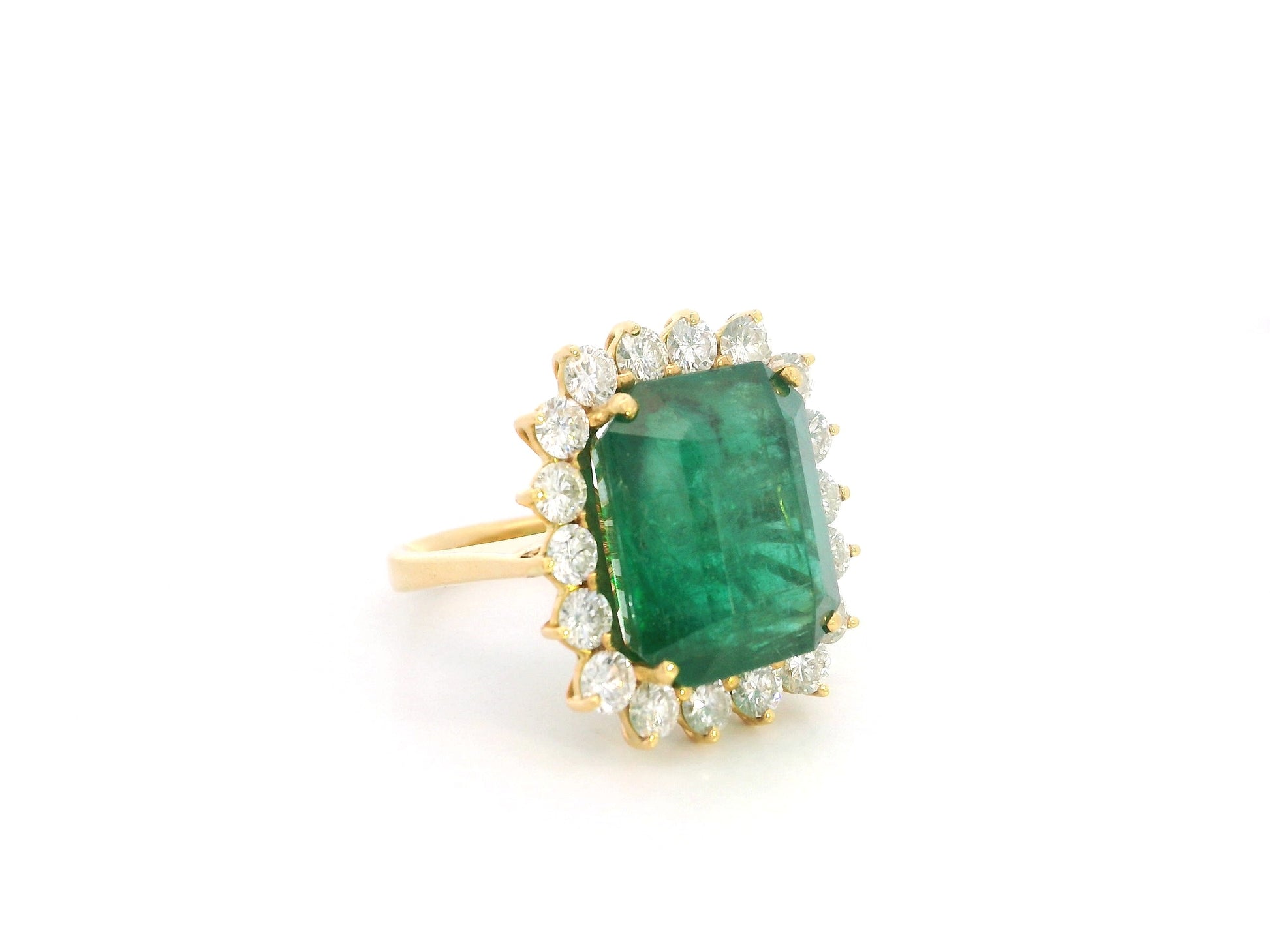 14.87 carat emerald and diamond halo statement ring in 18K yellow gold by Emirates Diamonds