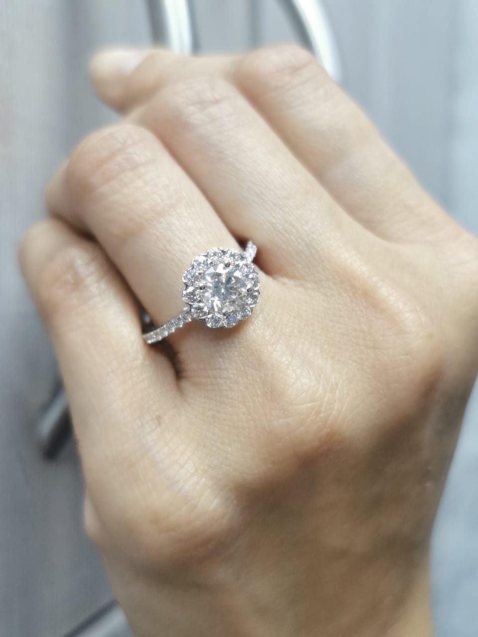 18K gold floral halo diamond ring with 1.00 carat center and 0.89 carat accent diamonds, vintage-inspired engagement design

