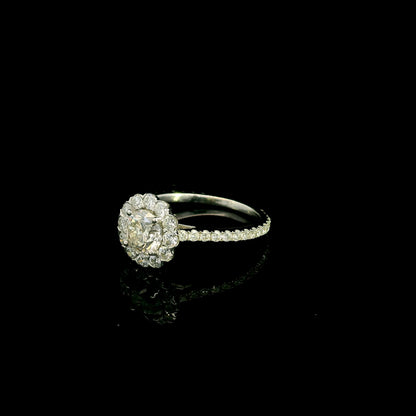 18K white gold halo diamond engagement ring featuring a 1.00 carat natural round brilliant diamond surrounded by a floral halo with pavé diamond band.