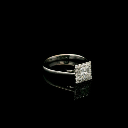 18K white gold princess cut diamond halo engagement ring featuring a 0.71 carat IGI certified E VS2 diamond with a sparkling natural diamond halo.