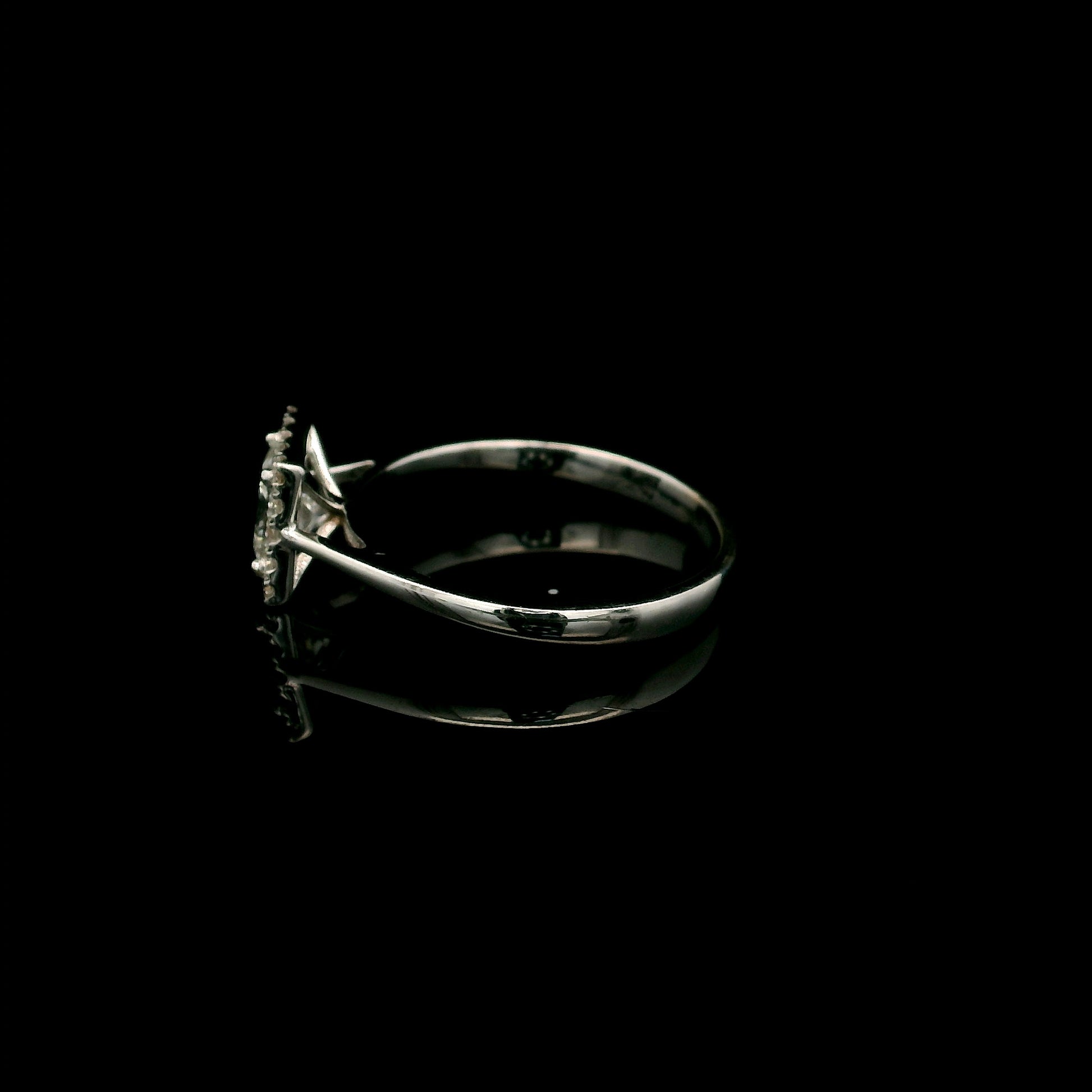 18K white gold princess cut diamond halo engagement ring featuring a 0.71 carat IGI certified E VS2 diamond with a sparkling natural diamond halo.
