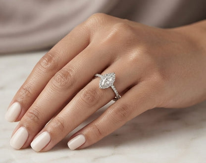 18K white gold marquise diamond halo engagement ring with diamond band featuring a 0.29 carat natural marquise cut centre diamond.