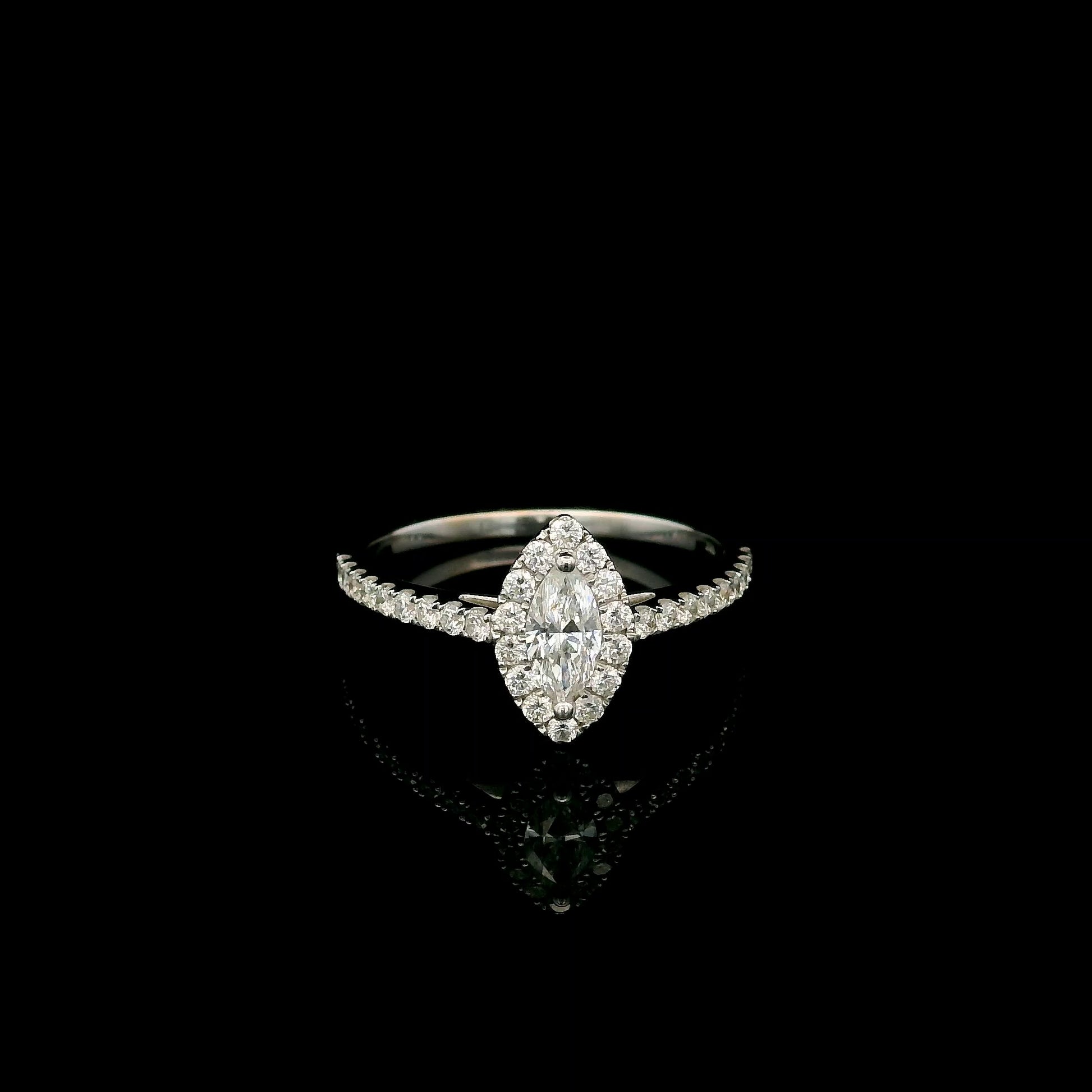 18K white gold marquise diamond halo engagement ring with diamond band featuring a 0.29 carat natural marquise cut centre diamond.