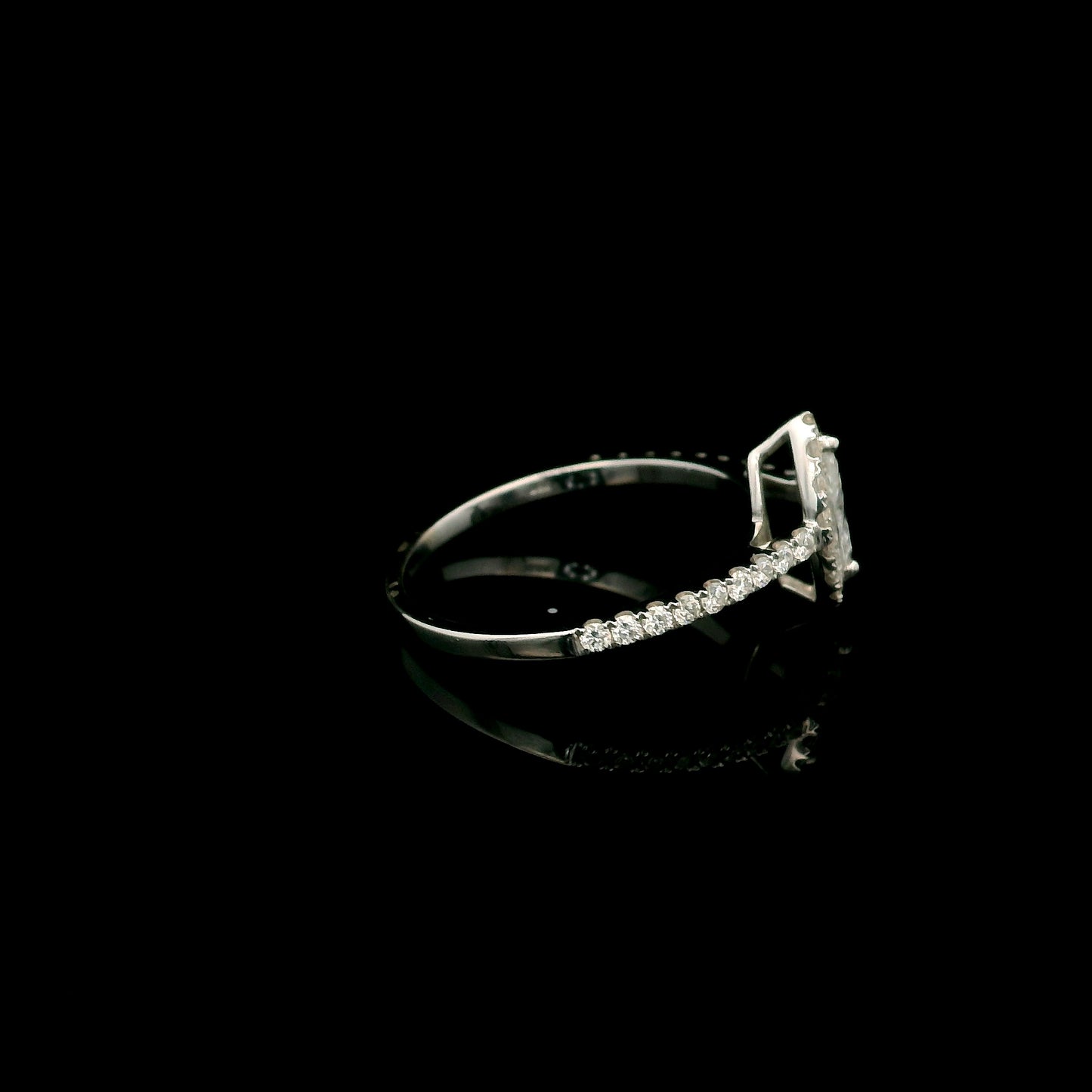 18K white gold marquise diamond halo engagement ring with diamond band featuring a 0.29 carat natural marquise cut centre diamond.