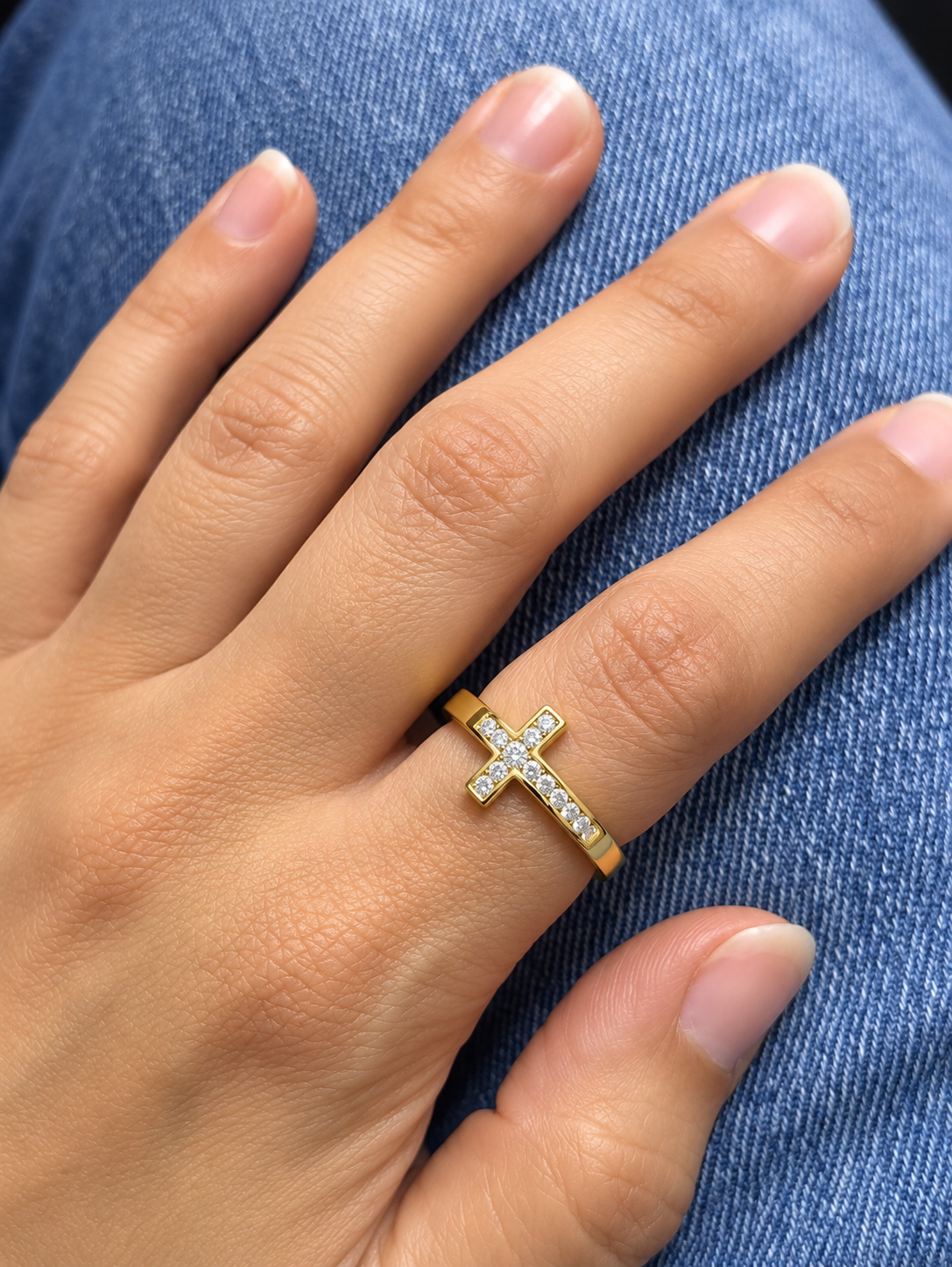 Diamond cross ring in 18K yellow gold featuring round brilliant diamonds set across a polished gold band in a distinctive cross design.
