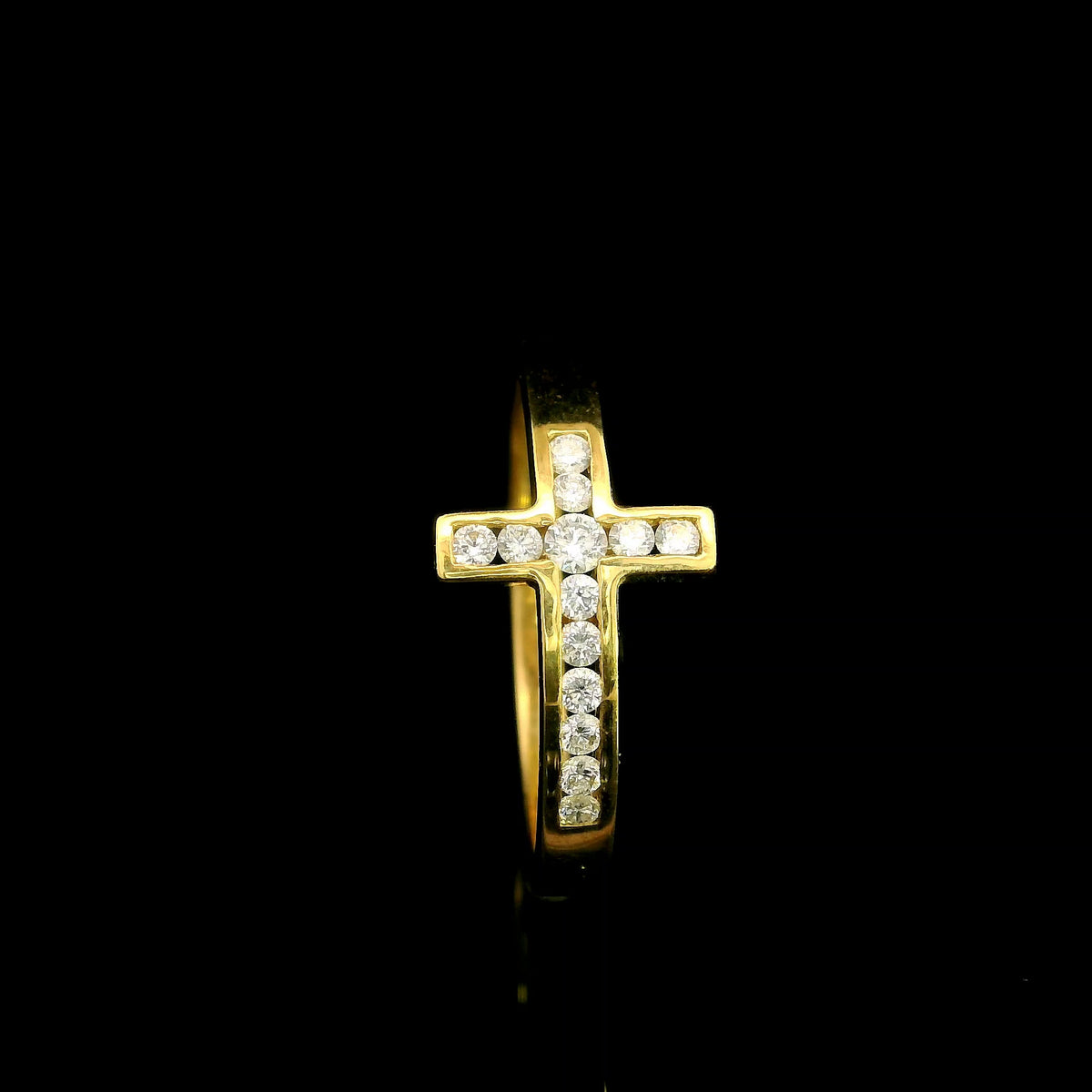 Diamond cross ring in 18K yellow gold featuring round brilliant diamonds set across a polished gold band in a distinctive cross design.