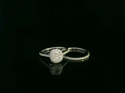 Cushion cut diamond bridal ring set in 18K white gold with diamond wedding band by Emirates Diamonds.