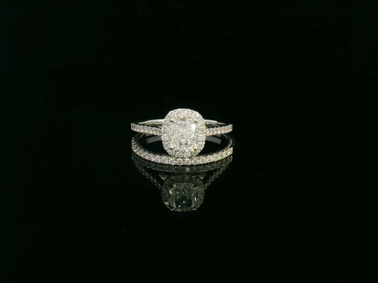 Cushion cut diamond bridal ring set in 18K white gold with diamond wedding band by Emirates Diamonds.