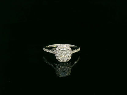 Cushion cut diamond bridal ring set in 18K white gold with diamond wedding band by Emirates Diamonds.