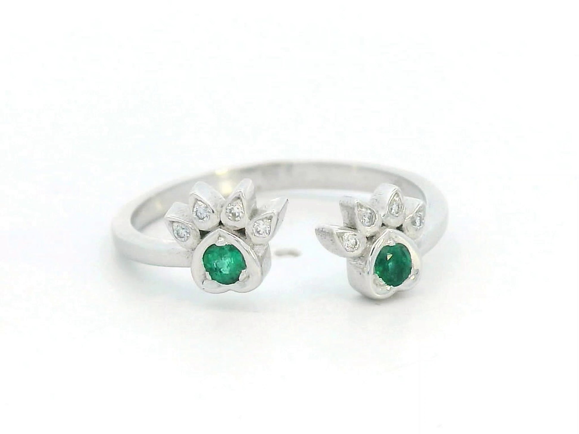 18K gold open band ring with emerald and diamond paw motifs