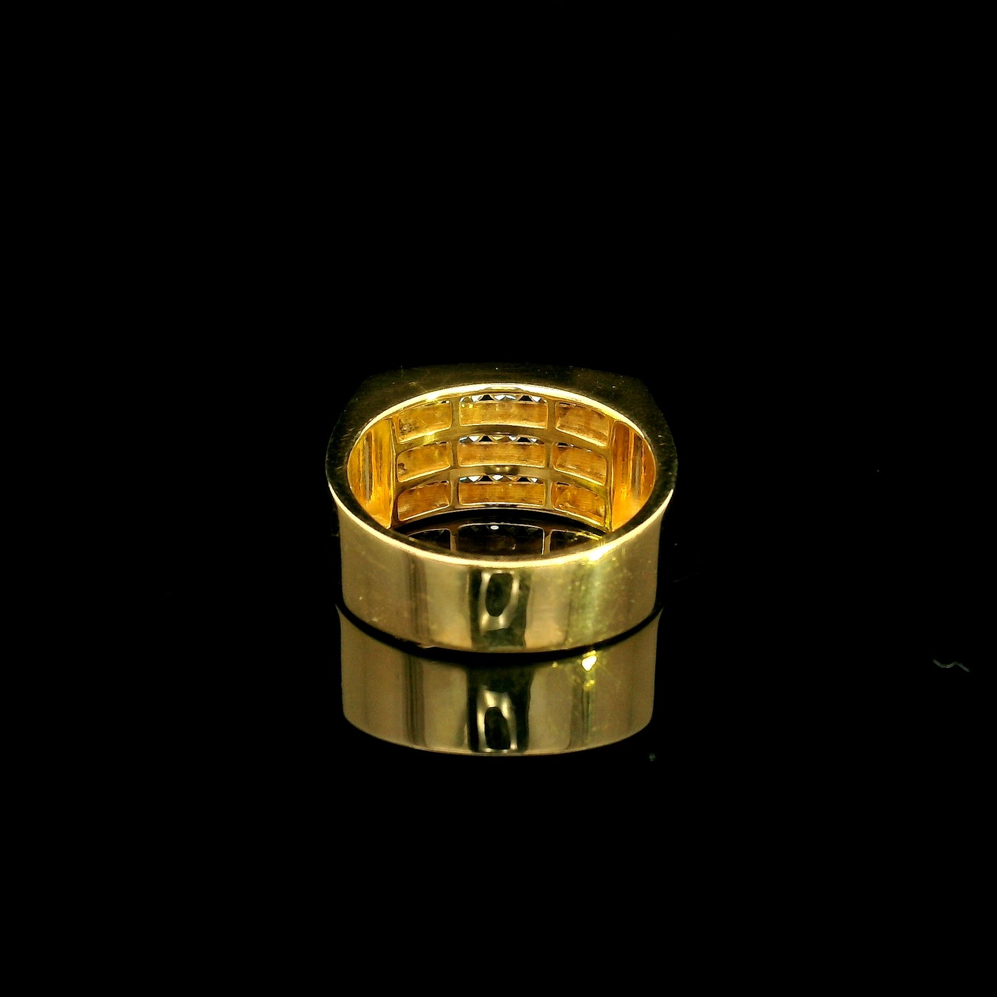 Men’s diamond statement ring in 18K yellow gold featuring three rows of round brilliant diamonds across a wide tapered gold band.
