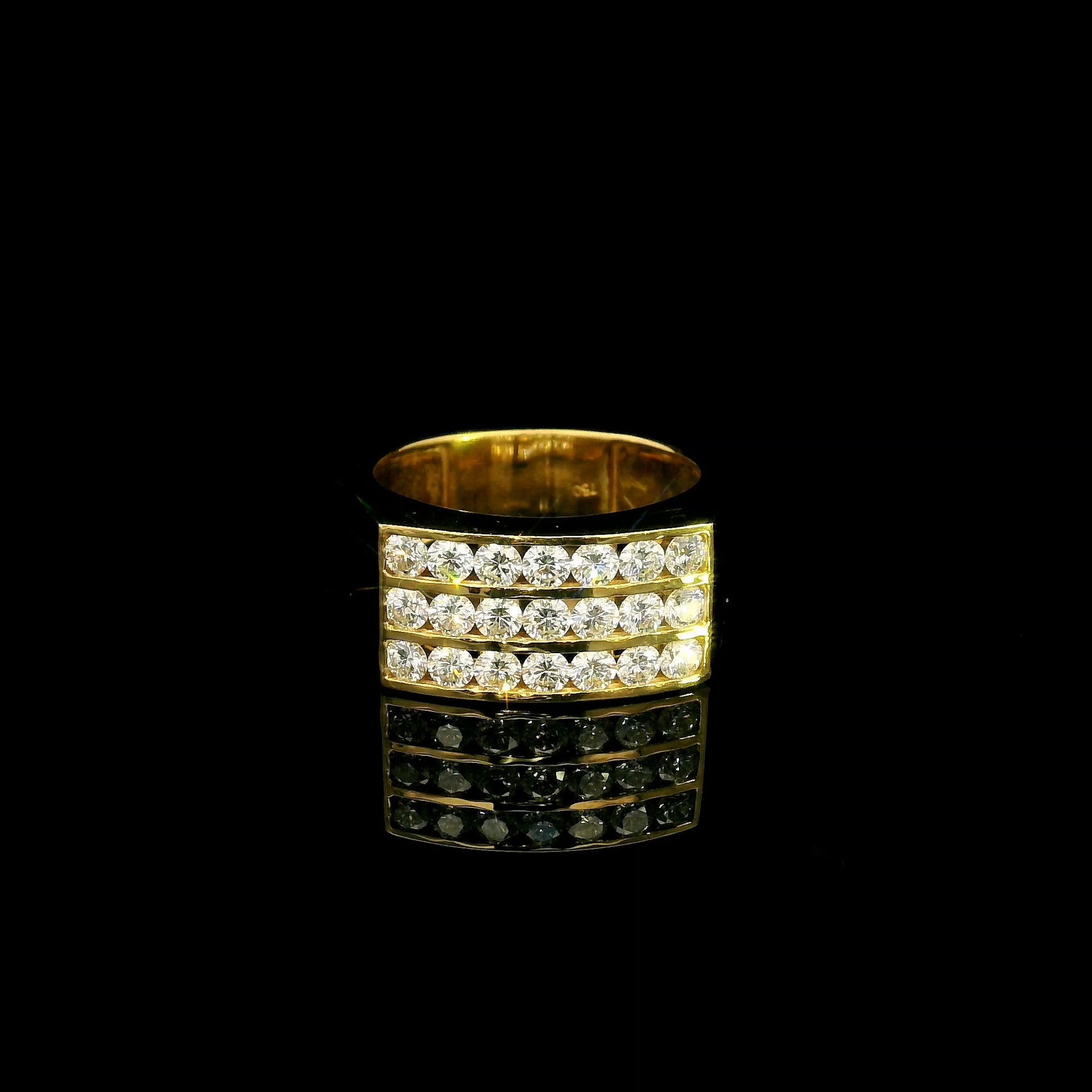Men’s diamond statement ring in 18K yellow gold featuring three rows of round brilliant diamonds across a wide tapered gold band.