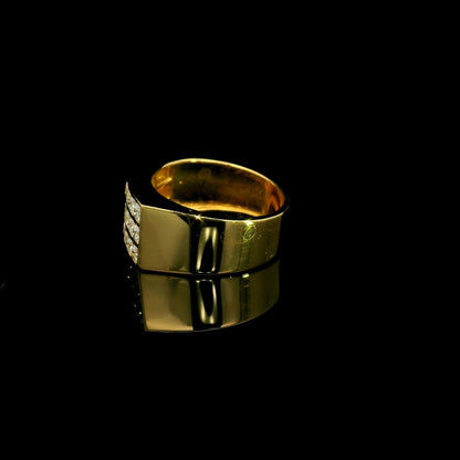 Men’s diamond statement ring in 18K yellow gold featuring three rows of round brilliant diamonds across a wide tapered gold band.