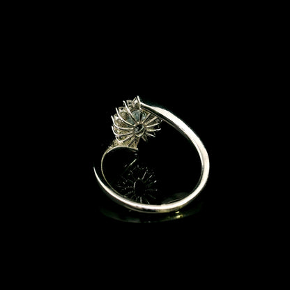 Oval aquamarine diamond halo ring with sweeping 18K white gold band