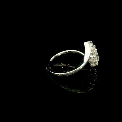 Oval aquamarine diamond halo ring with sweeping 18K white gold band