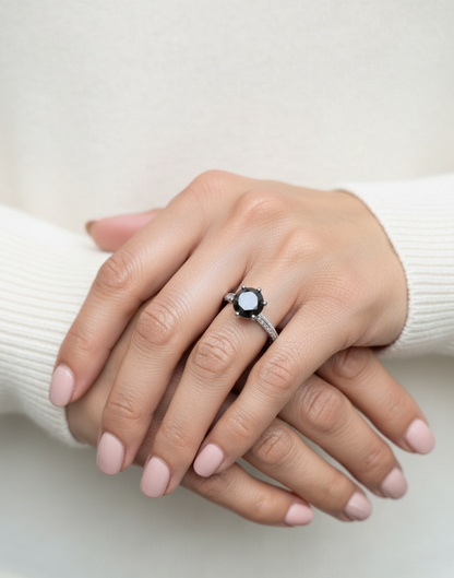 18K white gold black diamond solitaire ring with pavé diamond band by Emirates Diamonds.