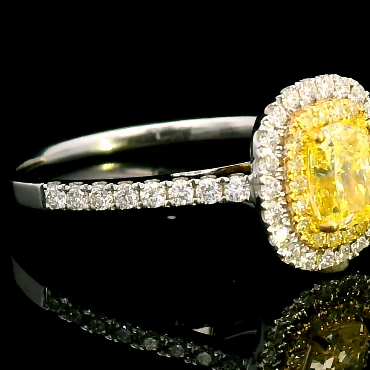 Exquisite Fancy Yellow Diamond Halo Ring in 18k Gold.