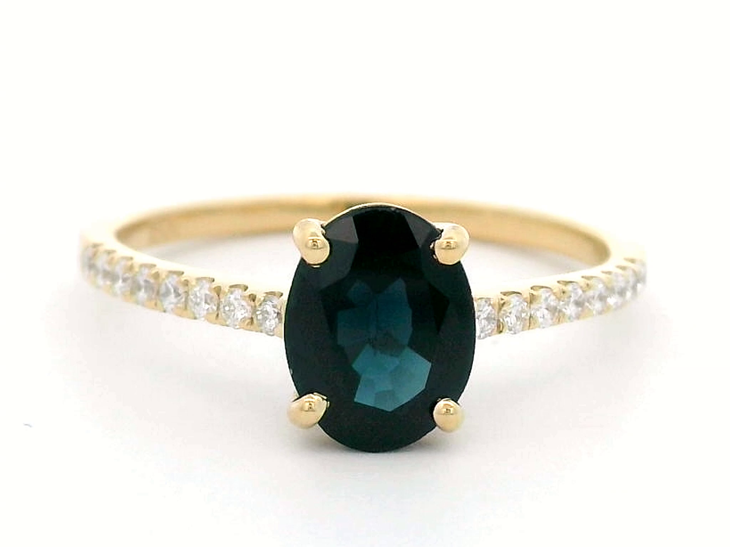 Oval Shape Blue Sapphire And Diamond Ring In 18k Yellow Gold.