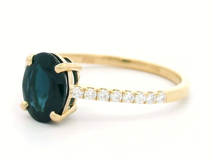 Oval Shape Blue Sapphire And Diamond Ring In 18k Yellow Gold.