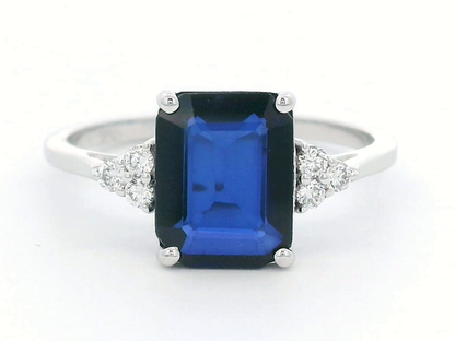 Stunning 18K Gold Emerald-Cut Sapphire Ring with Round Diamond Accents