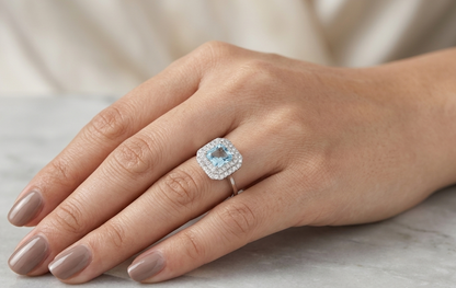 18K White Gold Asscher Cut Aquamarine Halo Ring featuring a 0.93 carat natural aquamarine surrounded by a double halo of 0.34 carat natural diamonds.