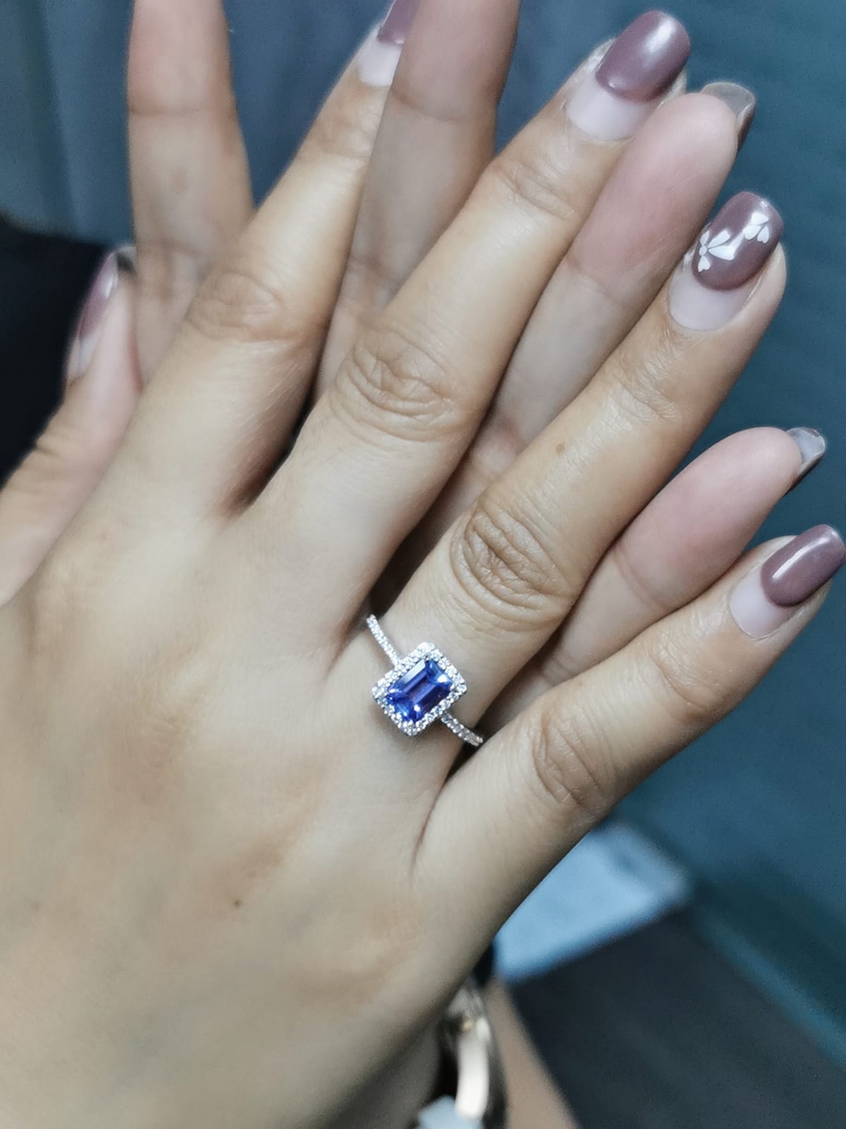 1.28ct Emerald Cut Tanzanite Ring with Diamond Halo in 18K Gold