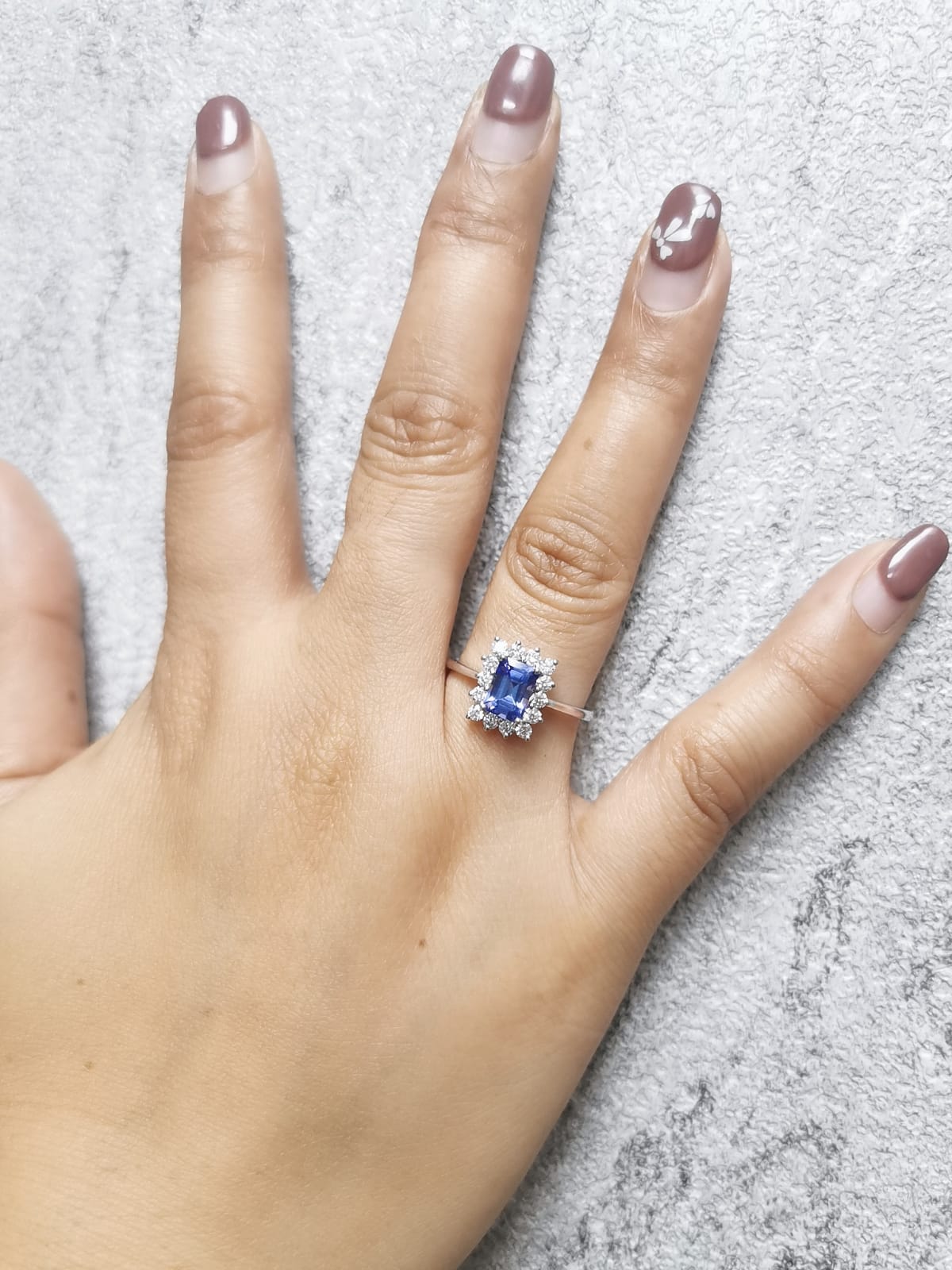 1.23 Carat Emerald-Cut Tanzanite and Diamond Halo Ring in 18K White Gold