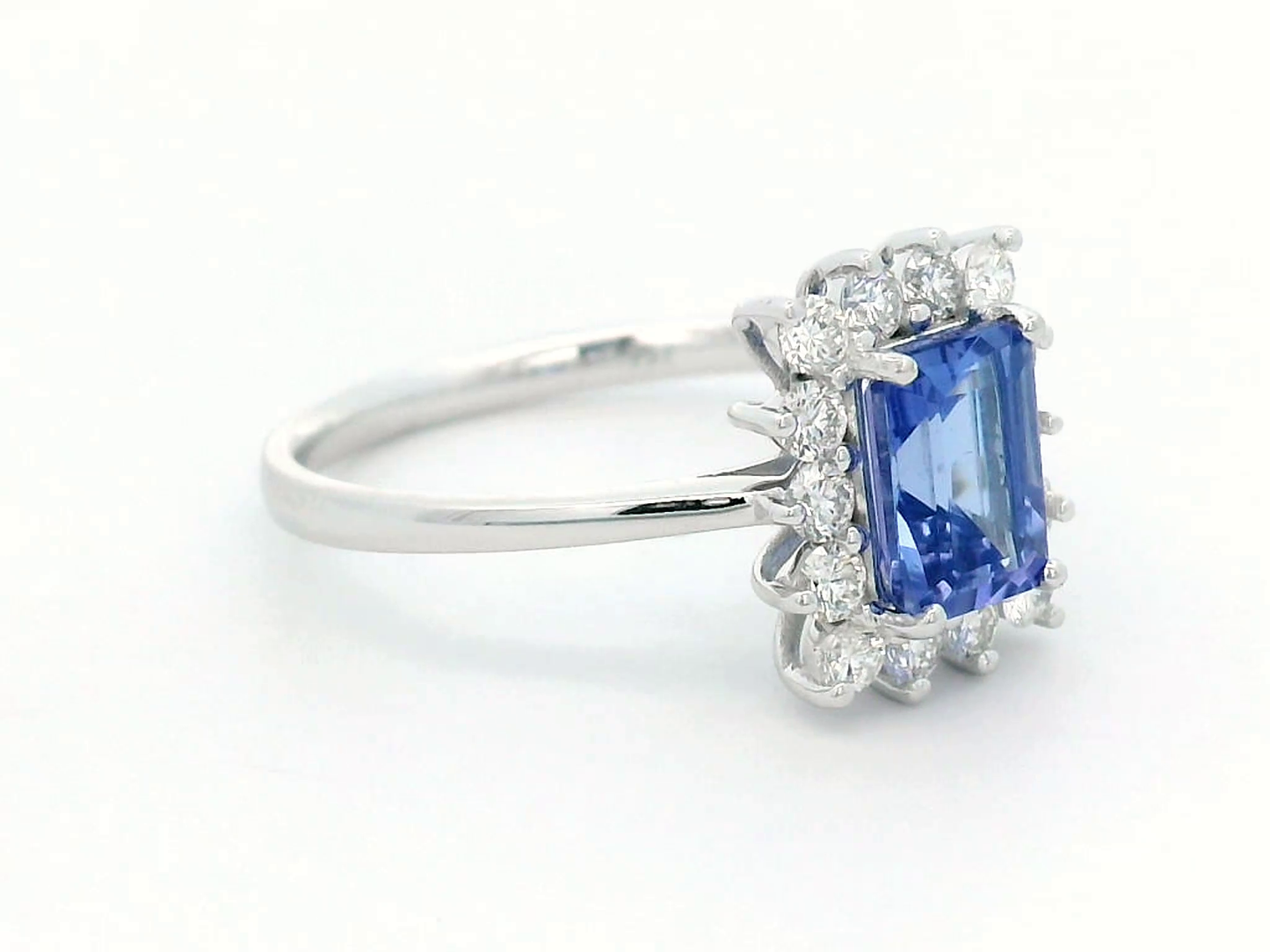 1.23 Carat Emerald-Cut Tanzanite and Diamond Halo Ring in 18K White Gold